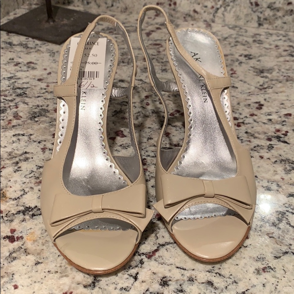 Peep toe sling back heels with bow detail